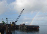 Crane barge with rainbow — coastal marine project — Keith Arjoon